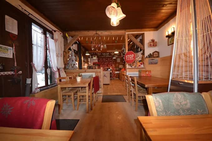 Rustic interior of a mountain restaurant with wooden tables and chairs