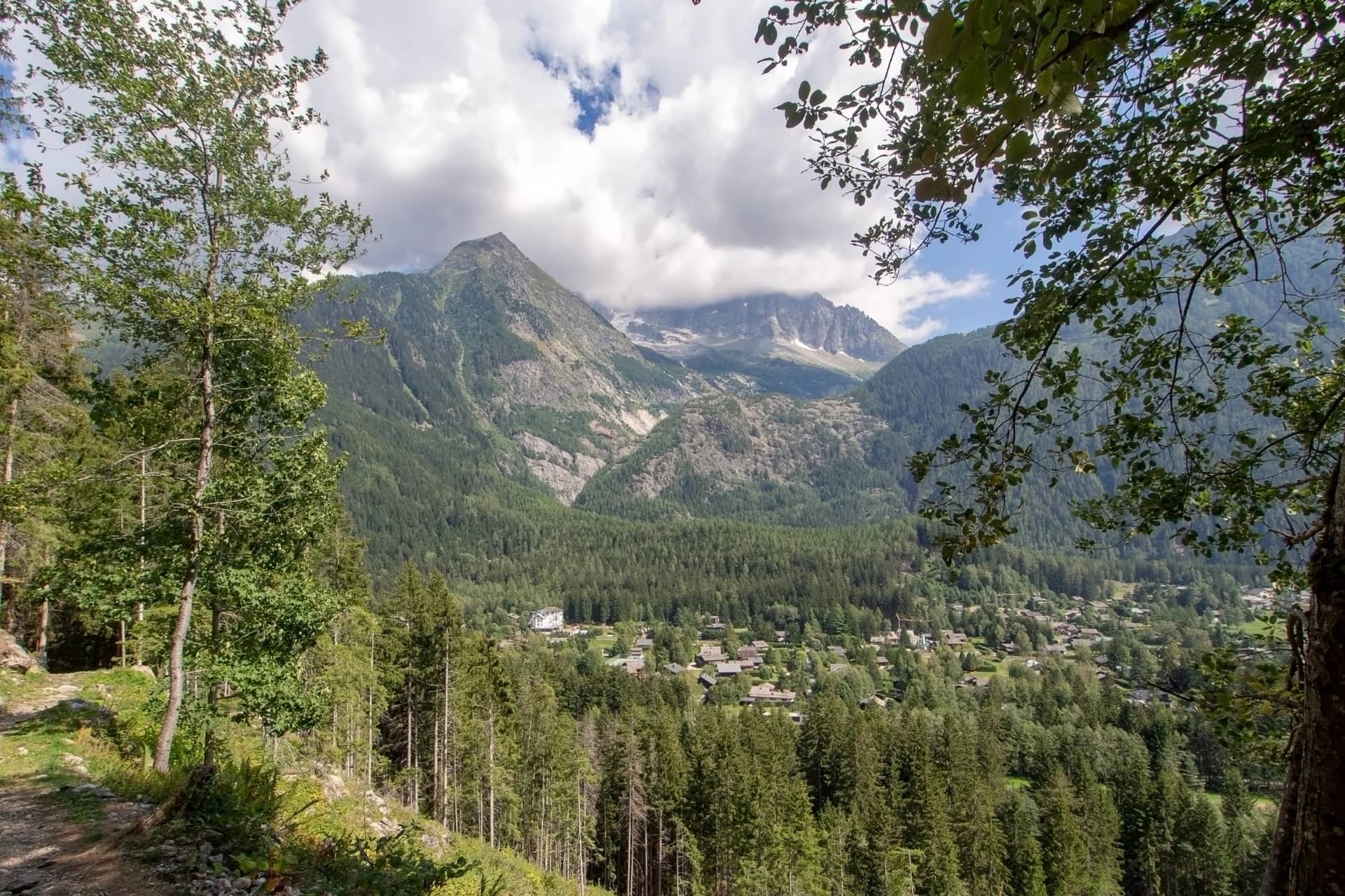 Hiking, trekking train path near Chamonix Mont BLanc, Haute Savoie, France in summer. View over the town from the petit balcon sud - the small south trail.
