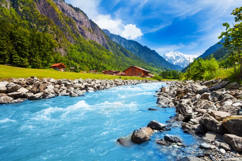 Swiss landscape with river stream and houses