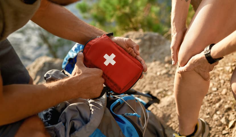 Young caucasian man holding first aid kit for healing