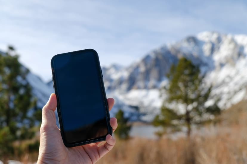 mobile phone and snow weather in the mountain.