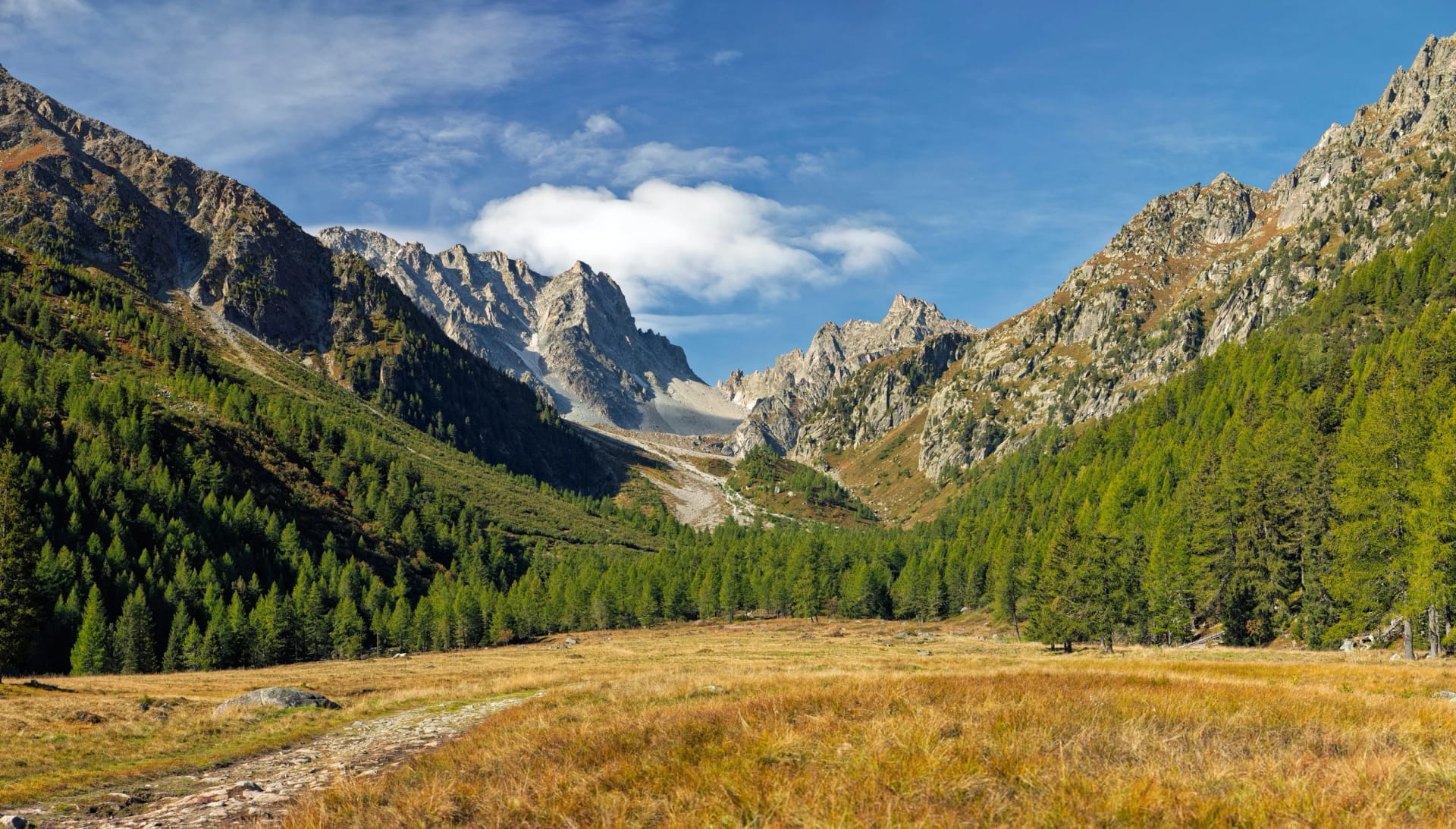 Valais, Switzerland - September 17, 2025: Steep and rocky hiking trail leading to the Col d'Arpette pass (2665m) on the Tour du Mont Blanc (TMB) trek.