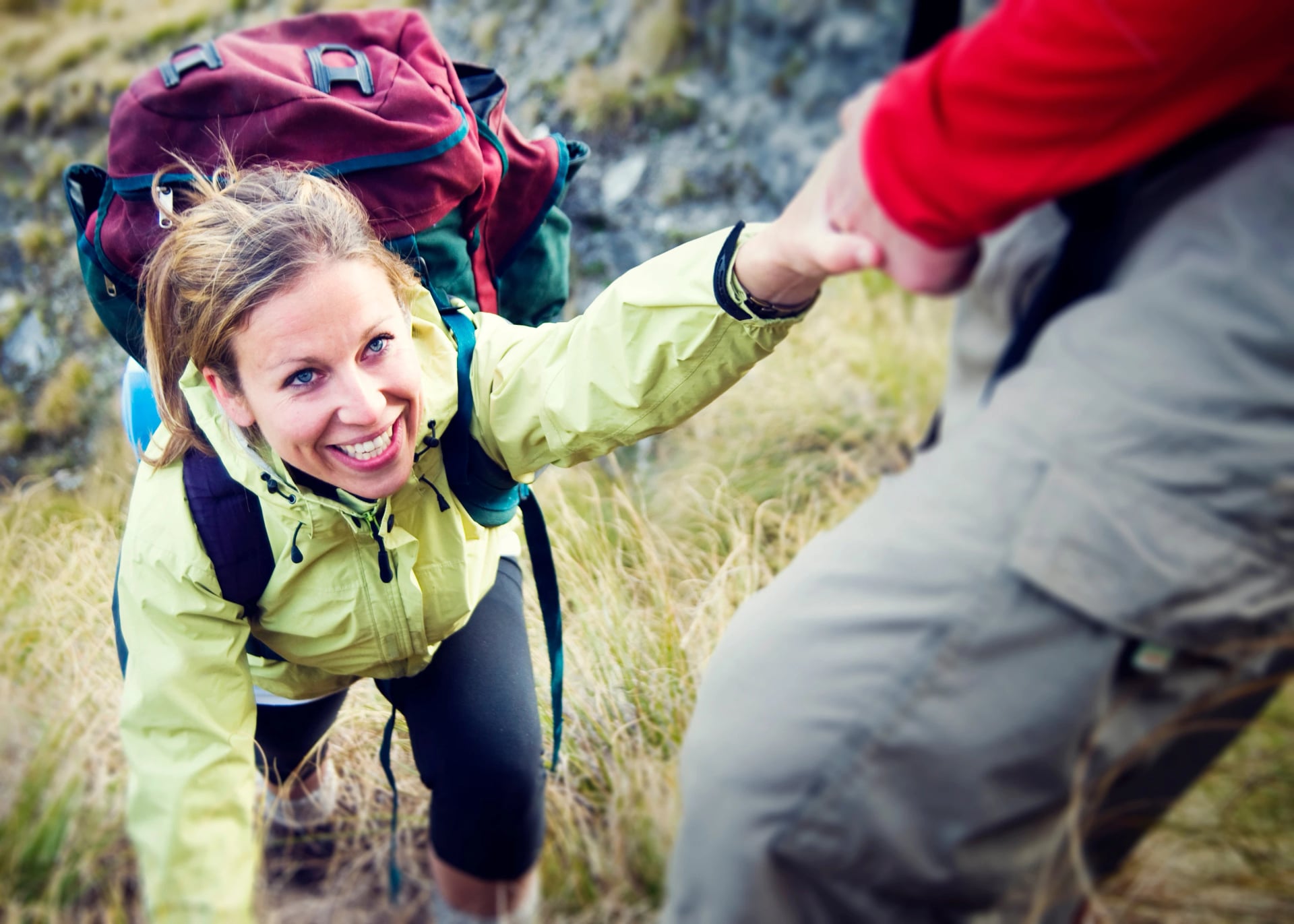 Couple Hiking Helping Climbing Mountain Concept