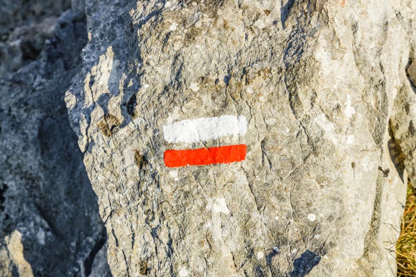 Red and white markers of the GR path that mark out the traditional french hiking trails on the Montagne Sainte-Victoire trail