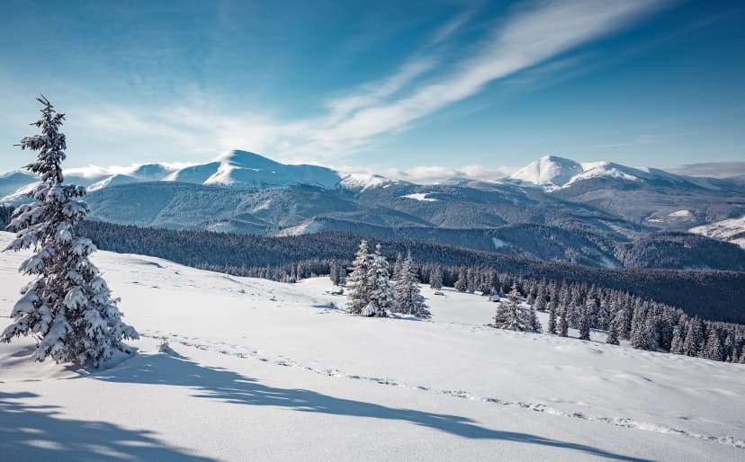 Wonderful Winter Landscape. Awesome Alpine Highlands in Sunny Day. Christmas holyday concept. Winter mountain forest. Snowy mountains and perfect blue sky. Amazing Nature background. postcard