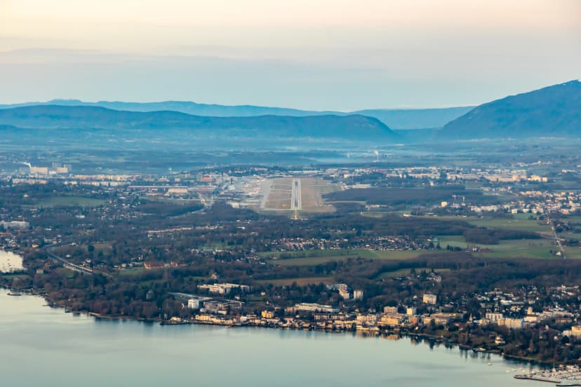 Cockpit view of Geneva airport with landing runway in soft morning light