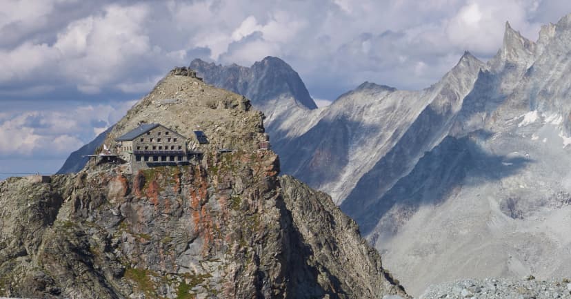 The Vignettes hut, an alpine Swiss mountain hut on the Glacier Haute Route from Chamonix to Zermatt. A breathtaking view on the Hut located at the edge of the mountain.