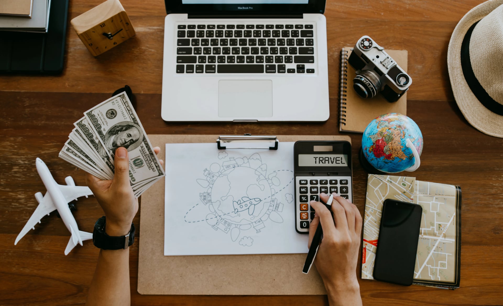 Travel budget concept, Young man planning vacation trip and calculate travel expenses.