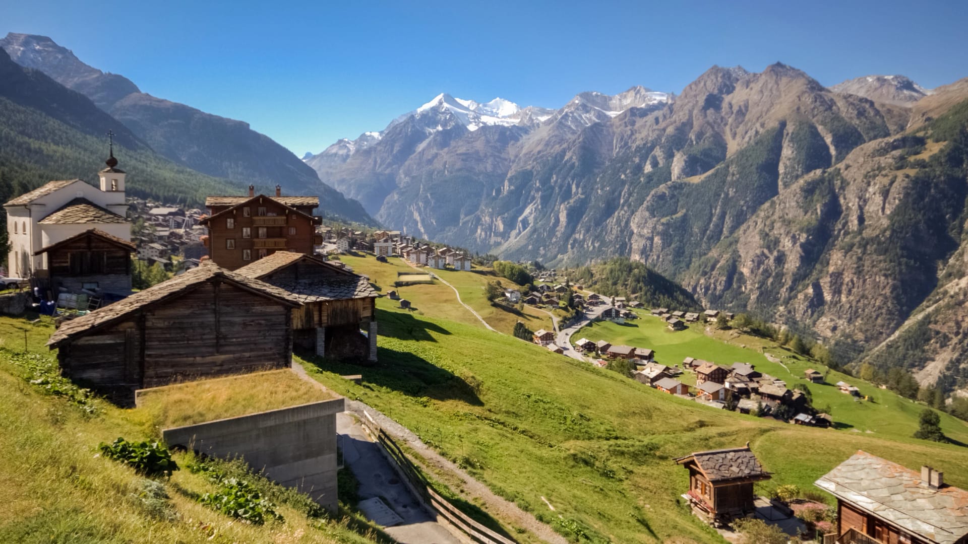 View of the village of Grachen (Valais, Switzerland) on a sunny and clear autumn september day. The village is situated at an altitude of 1,620 meters on a terrace above St. Niklaus in the Mattertal