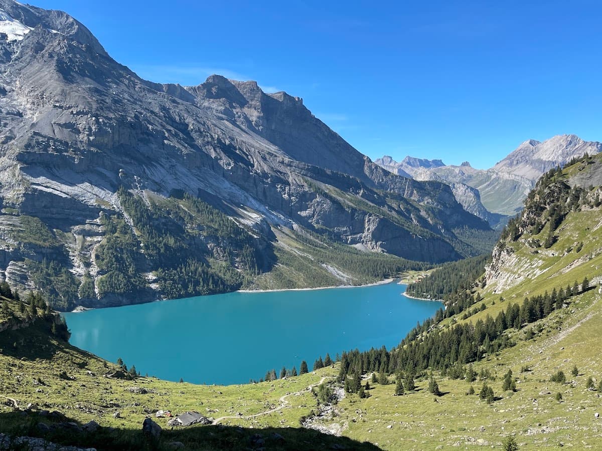 Alpine mountain lake with turquoise water and surrounding peaks