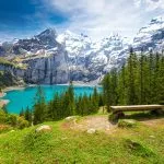 Amazing tourquise Oeschinnensee with waterfalls and Swiss Alps Kandersteg