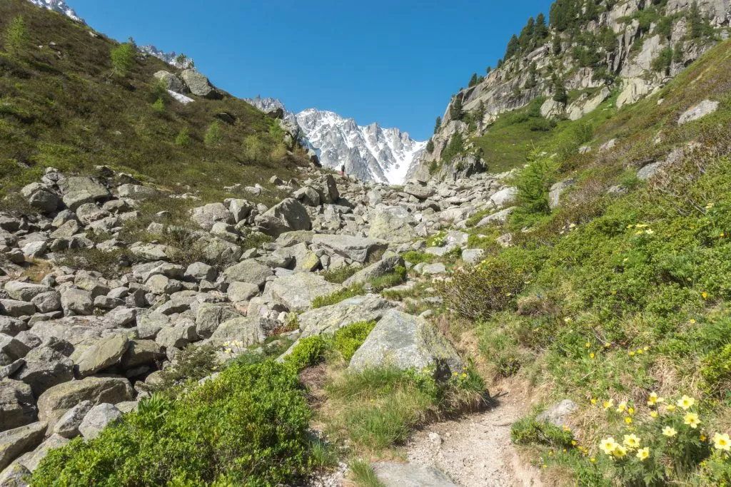 Steep mountain trail hiking up the summit in spring Fenetre d'Arpette