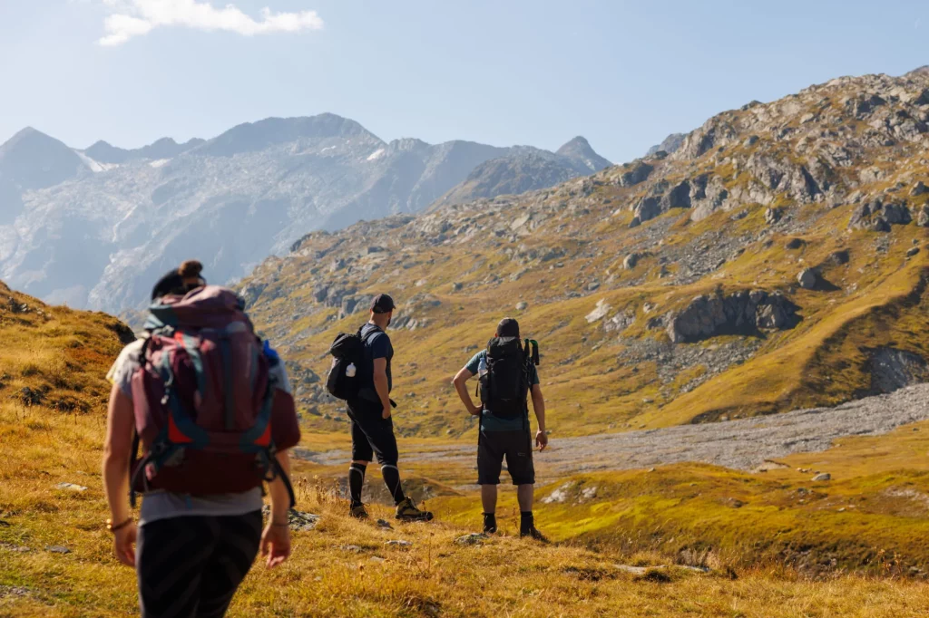 hiker on alpine plateau of Greina, Surselva